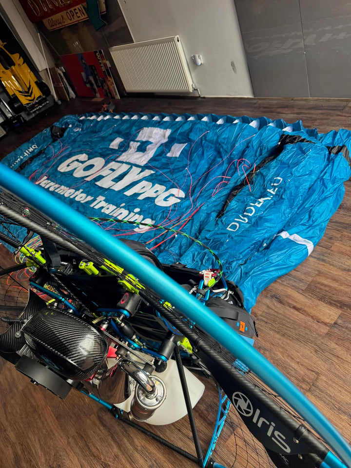 UK made paramotor with blue Dudek wing and printed vinyl graphics for powered paragliding